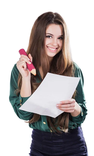 Beautiful young girl with a big piece of paper and a pencil on a white background — Stok fotoğraf