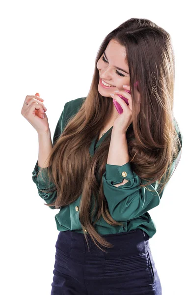 Belle jeune fille sur un fond blanc est un téléphone cellulaire rose telefonom.Govorit. Sourires. Étonné . — Photo