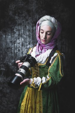Medieval woman holds SLR camera clipart