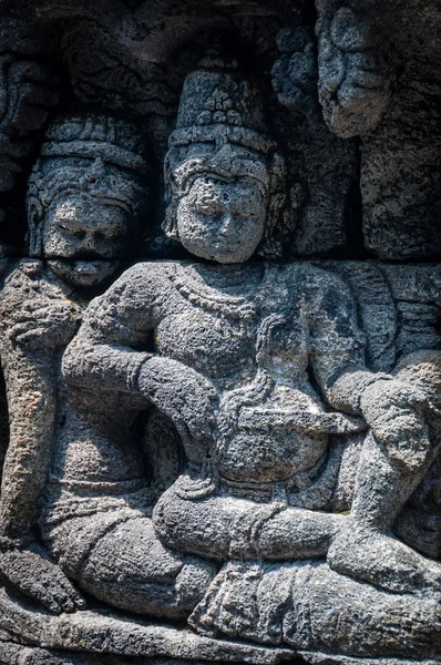 Medidating y sentado Tallado en piedra en Borobudur — Foto de Stock