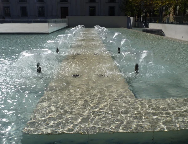 Row of small fountains on a square — Stock Photo, Image