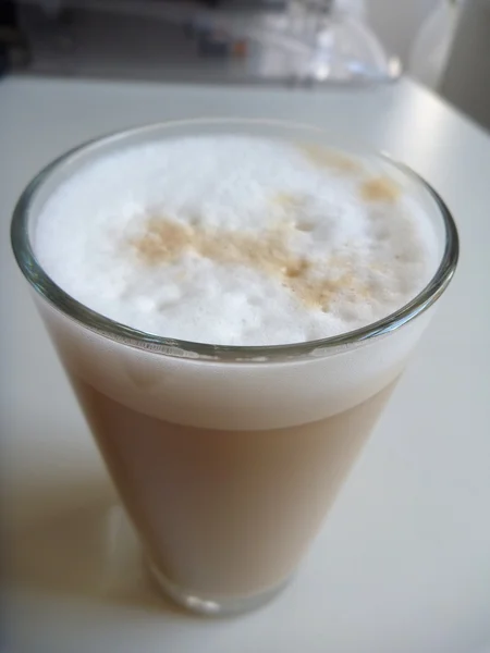 Glass of fresh tasty cafe latte — Stock Photo, Image