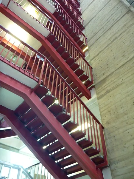 Red steel open staircase in a building — Stock Photo, Image