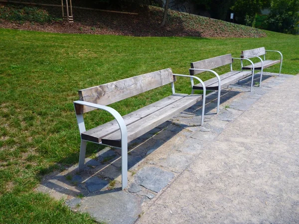 Three benches in a calm park — Stock Photo, Image