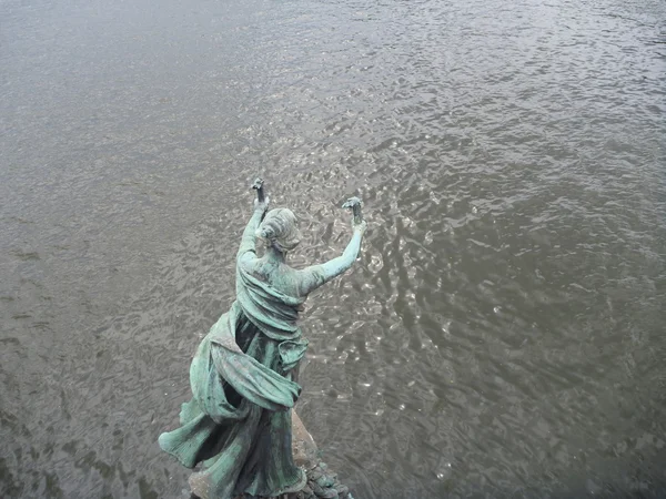 Metal statue on an old bridge in prague — Stock Photo, Image