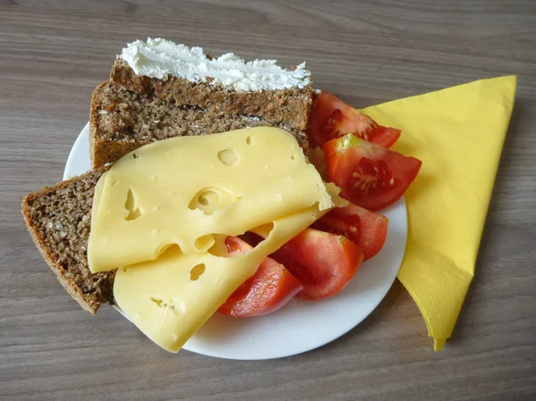 Snack with slices of bread cheese and tomato — Stock Photo, Image