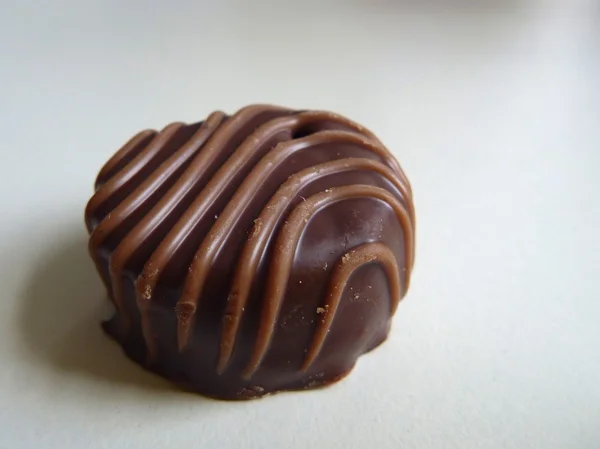 small decorated brown chocolate candy