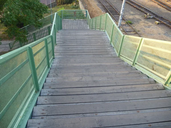 Old outdoor staircase with green railing — Stock Photo, Image