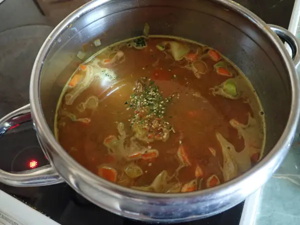 fresh homemade  cooking vegetable soup in a pot