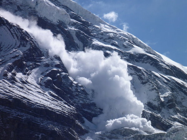 an avalanche at the slope of Dhaulagiri