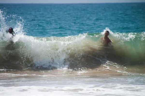 Two man men diving swimming on huge big wave — Stock Photo, Image