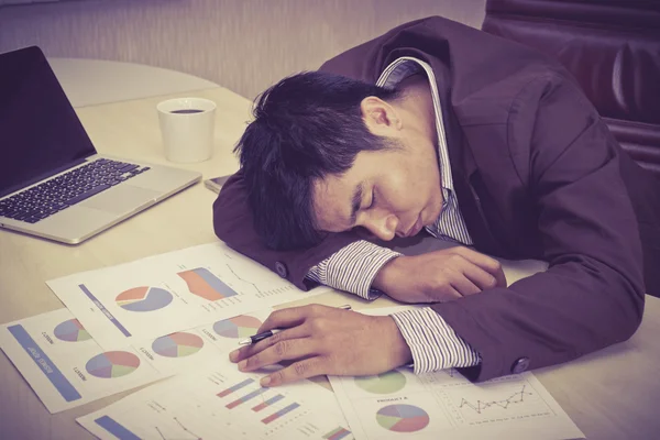 Tired businessman sleeping