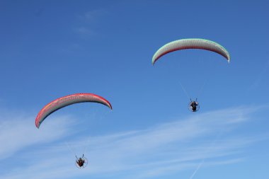 two flying paragliders clipart