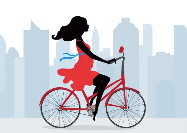 Pregnant woman rides a Bicycle on the background of the city