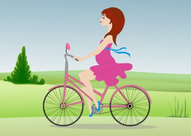 Hamile kadın alanın karşısındaki bir bisiklet ile gidiyor
