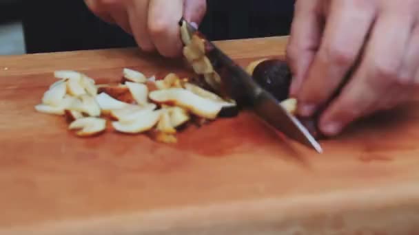 Chopping  porcini mushrooms — Stock Video
