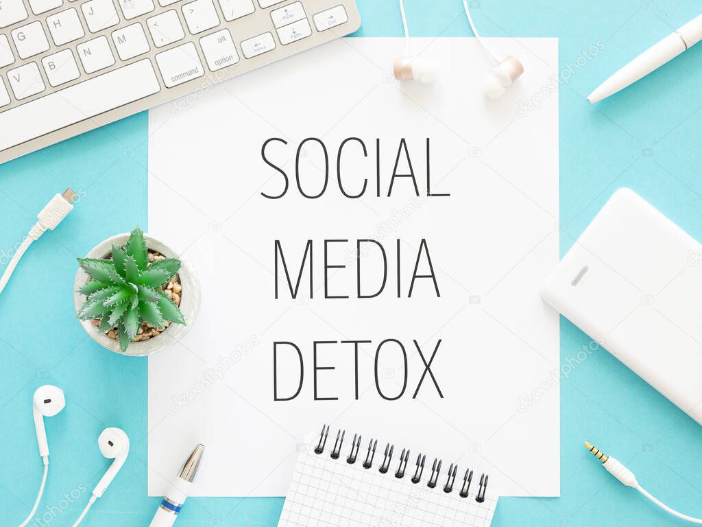 Social media detox text framed with gadgets. Social media addiction concept top view workspace