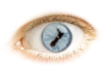 Close-up of an eye with the pupil in the shape of New Zealand.(s