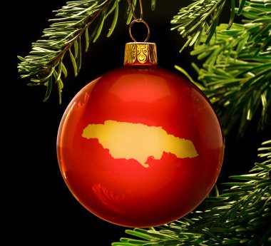 Red bauble with the golden shape of Jamaica hanging on a christm