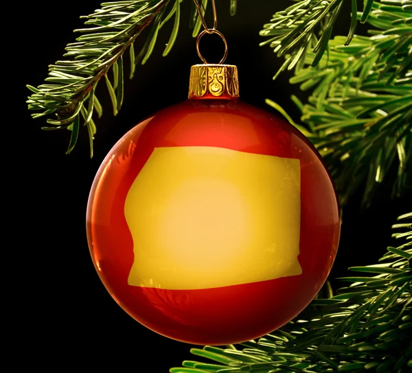 Red bauble with the golden shape of Equatorial Guinea hanging on — 图库照片
