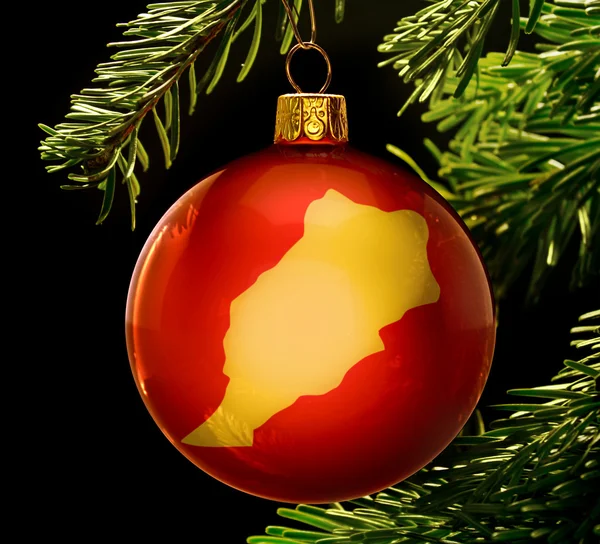 Red bauble with the golden shape of Morocco hanging on a christm — 图库照片