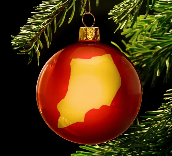 Red bauble with the golden shape of Uganda hanging on a christma — 图库照片