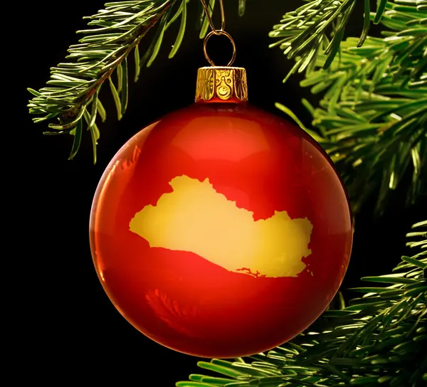 Red bauble with the golden shape of El Salvador hanging on a chr — Stock fotografie