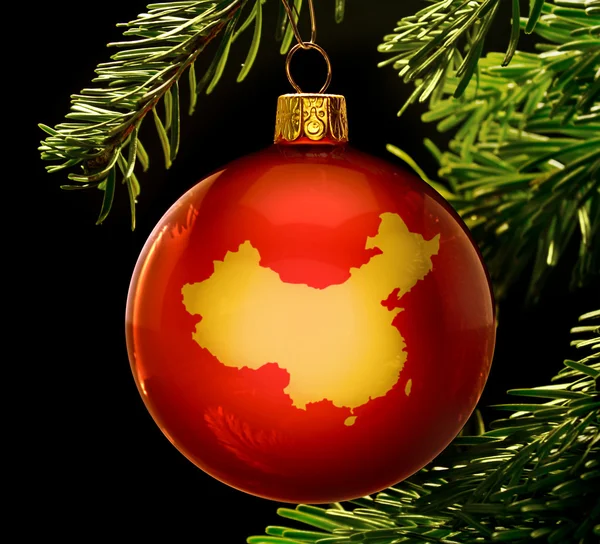 Red bauble with the golden shape of China hanging on a christmas — 图库照片