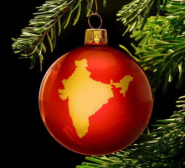 Red bauble with the golden shape of India hanging on a christmas — 图库照片