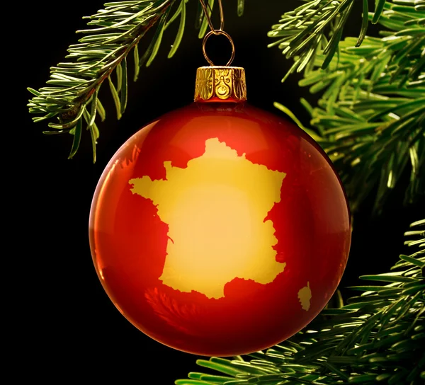 Red bauble with the golden shape of France hanging on a christma — стокове фото