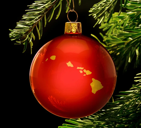 Red bauble with the golden shape of Hawaii hanging on a christma — 图库照片