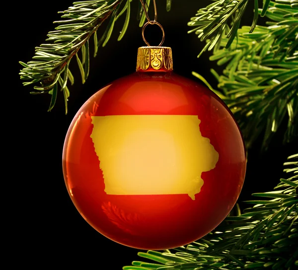 Red bauble with the golden shape of Iowa hanging on a christmas — 图库照片