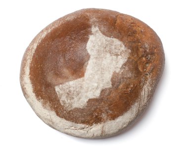 A loaf of fresh bread covered with rye flour in the shape of Oma