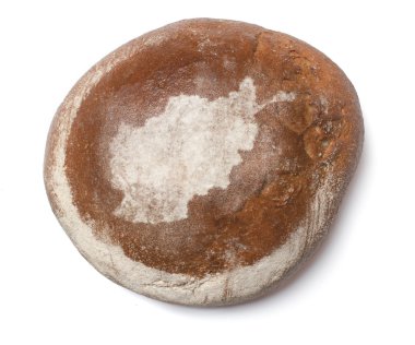 A loaf of fresh bread covered with rye flour in the shape of Afg