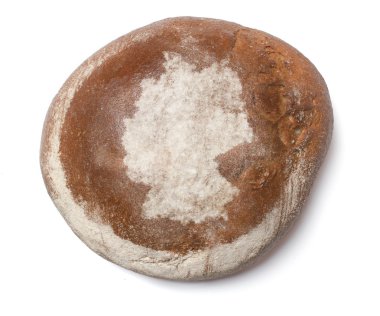 A loaf of fresh bread covered with rye flour in the shape of Ger
