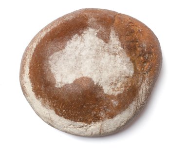 A loaf of fresh bread covered with rye flour in the shape of Aus