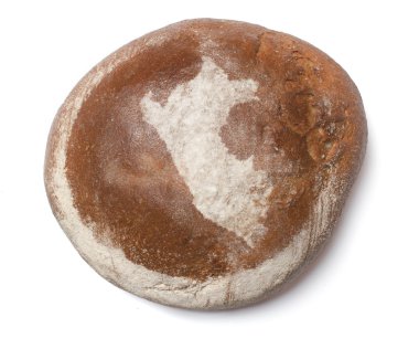 A loaf of fresh bread covered with rye flour in the shape of Per
