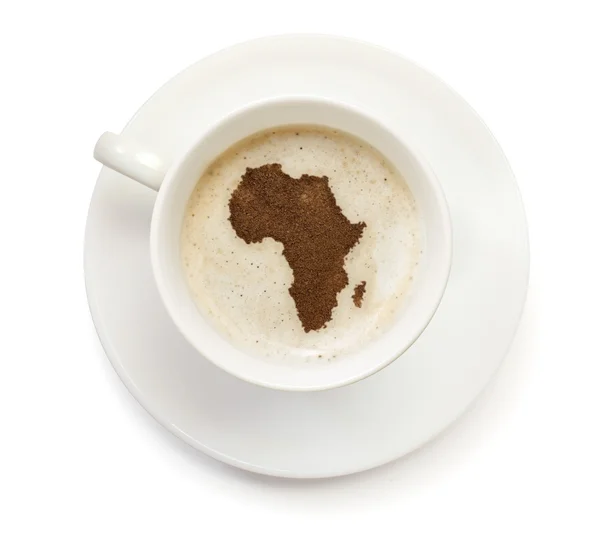 Cup of coffee with foam and powder in the shape of Africa.(serie — Stockfoto