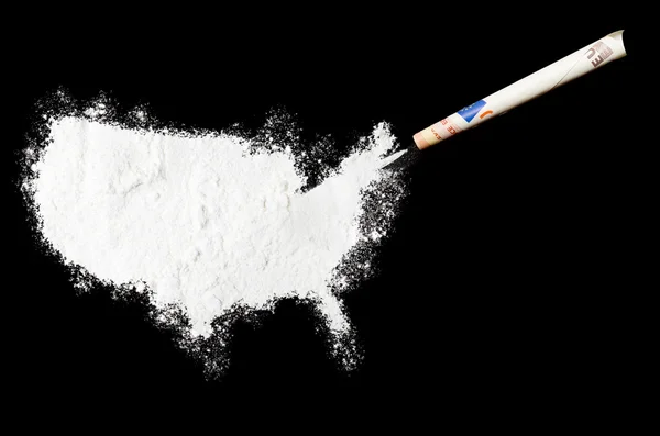Powder drug like cocaine in the shape of USA.(series) 免版税图库照片