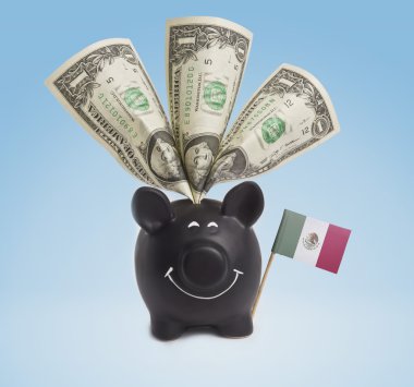 One dollar banknotes in a happy piggybank of Mexico.(series)