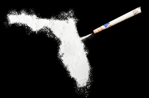 Powder drug like cocaine in the shape of Florida.(series) 图库图片