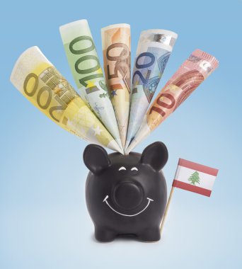 Various european banknotes in a happy piggybank of Lebanon.(seri
