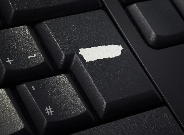 Keyboard with return key in the shape of Puerto Rico.(series) — Stock Photo, Image