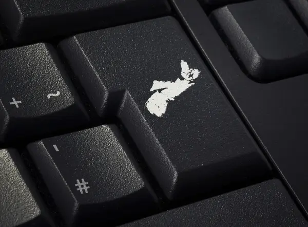 Keyboard with return key in the shape of Nova Scotia.(series) — Stockfoto