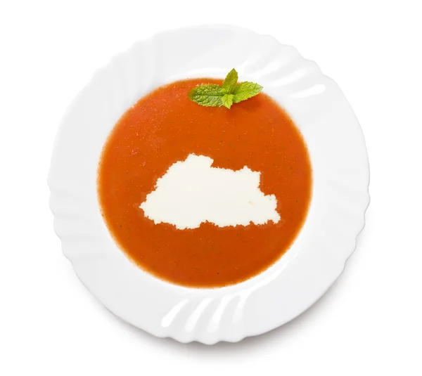 Plate tomato soup with cream in the shape of Bhutan.(series) — 스톡 사진