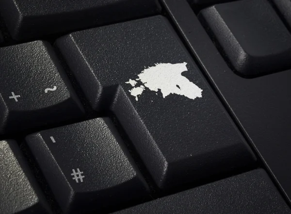 Keyboard with return key in the shape of Estonia.(series) 图库照片