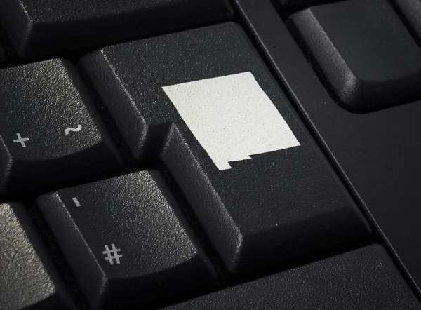 Keyboard with return key in the shape of New Mexico.(series) Stock Image