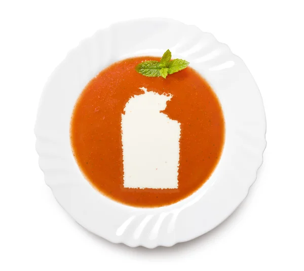Пластина томатний суп з вершками у формі Північної території. — стокове фото
