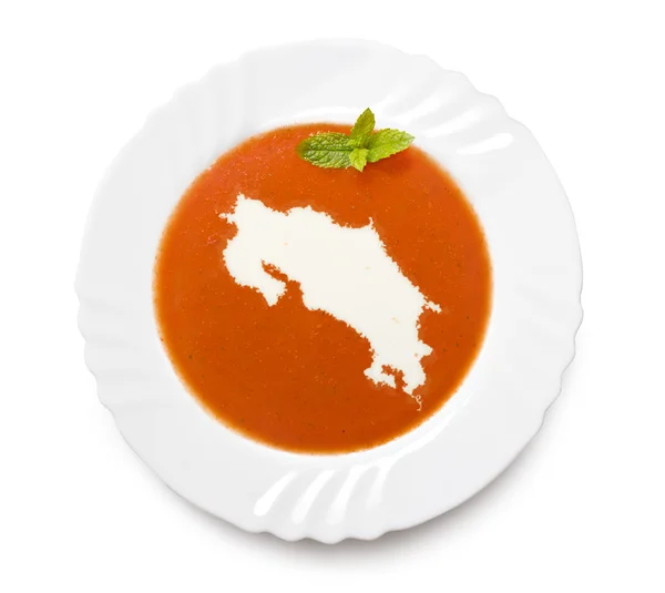 Lempeng sup tomat dengan krim dalam bentuk Kosta Rika. (seri ) — Stok Foto