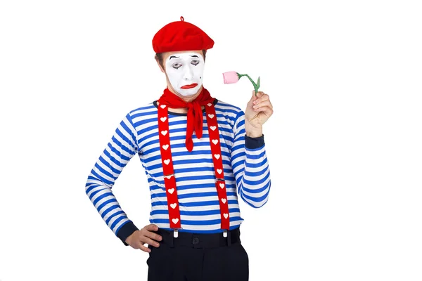 Mime with flower.Emotional funny actor wearing sailor suit, red beret posing on white isolated background. — Zdjęcie stockowe